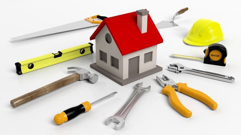 House model with tools isolated on white background